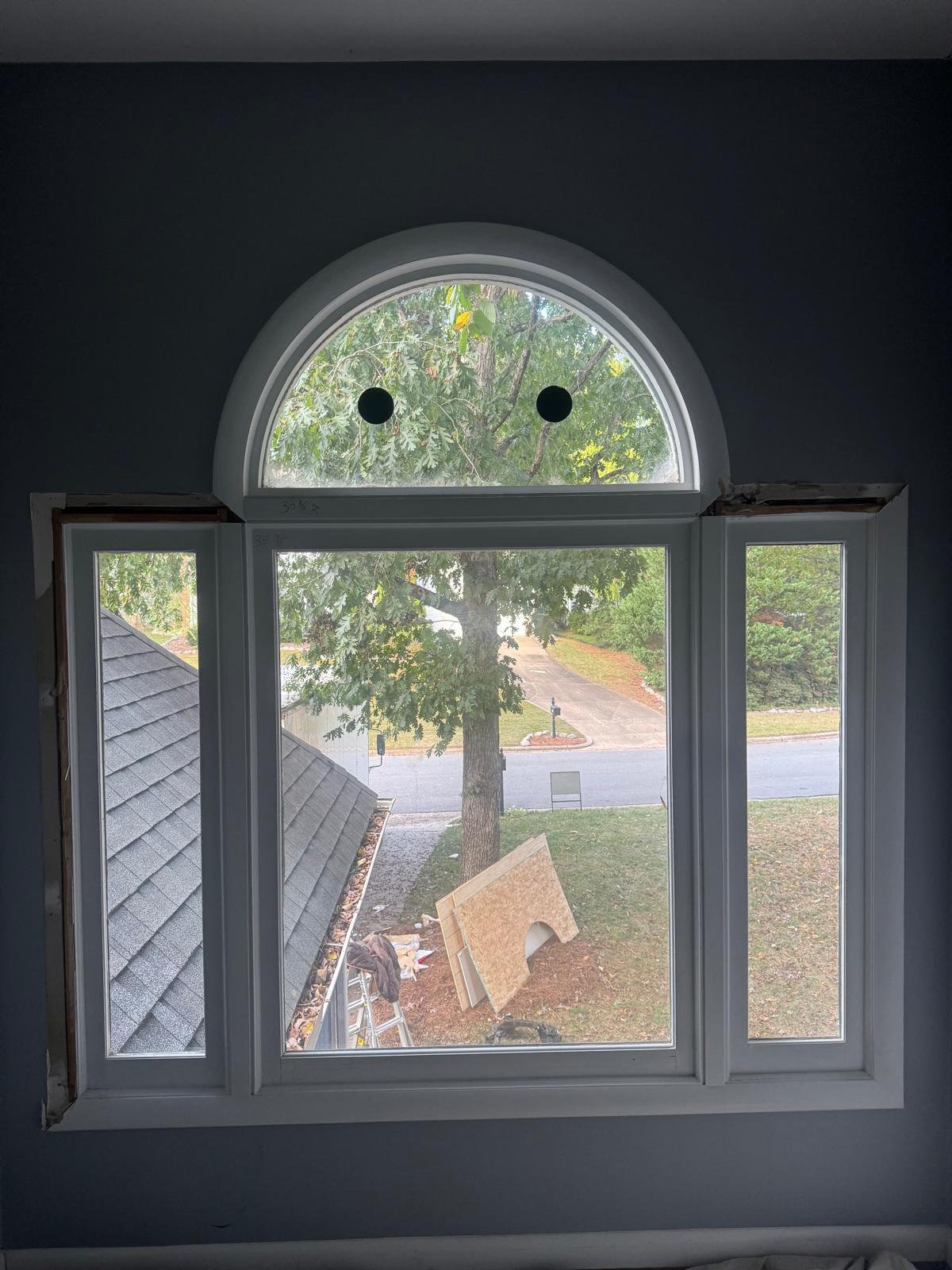 New custom arch-top window installed in the same opening