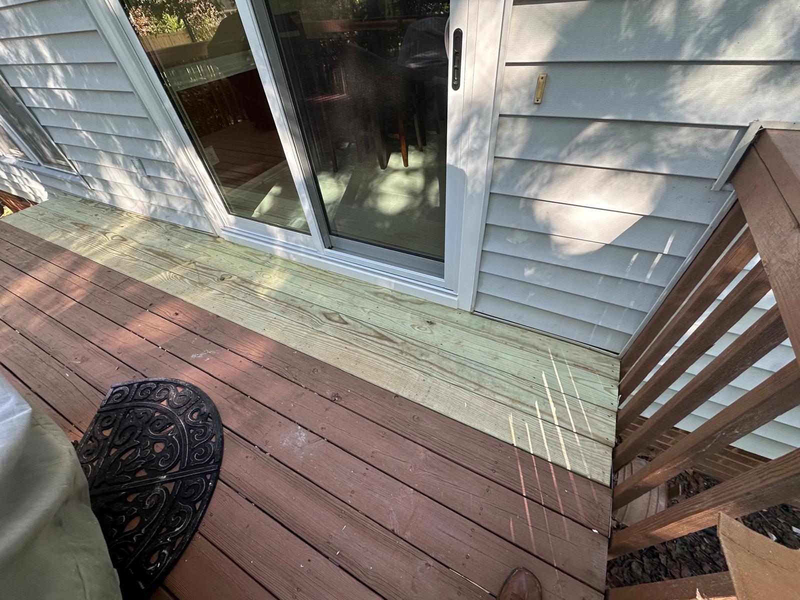 Finished sliding patio door installed at the same deck doorway